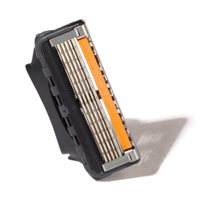 Gillette razor blade cartridge with multiple blades and an orange lubricating strip.