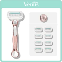 Gillette Venus rose gold razor with shower holder and eight refill blades.