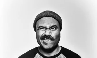 A man wearing beanie with a moustache