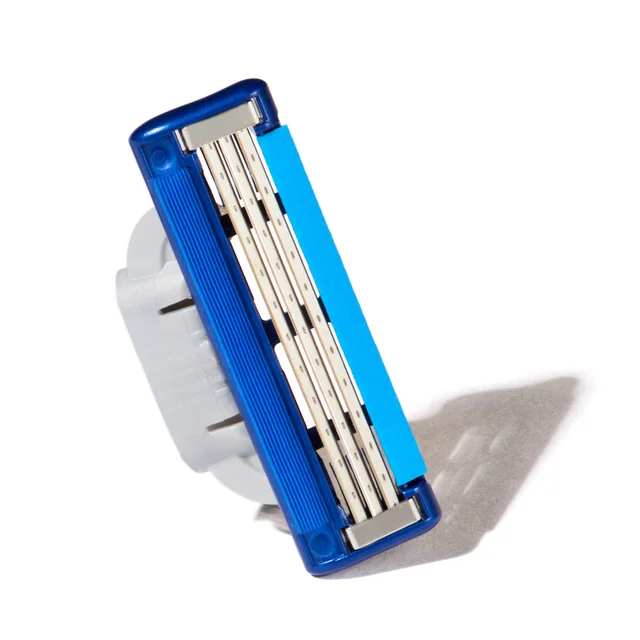 Gillette razor head with multiple blades and blue lubricating strip.