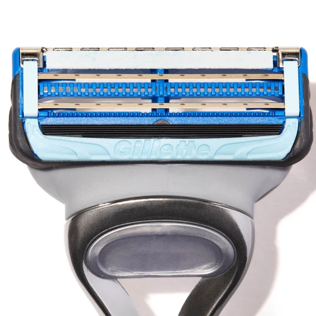 Gillette multi-blade razor head with lubrication strips, showing the brand logo.