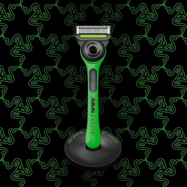 Gillette x Razer razor, green and black, on its stand with 'FOR GAMERS, BY GAMERS'.